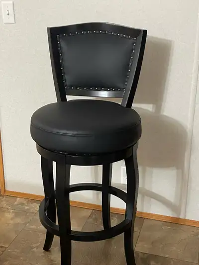 2 nearly new wood and leather bar stools excellent condition well taking care of .no scratches and t...