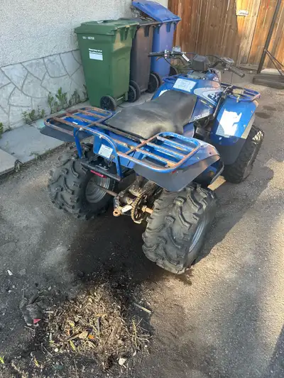 1993 two-stroke 4 x 4 Polaris 250 Trail Boss The tires are worth more than what I’m selling it for....