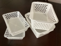 Brand new white plastic baskets/ containers