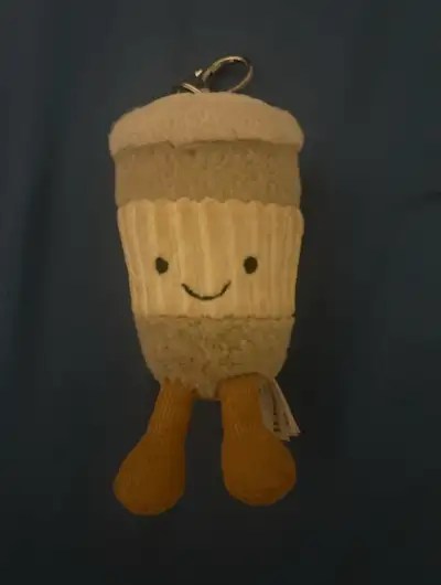 This is a Jellycat coffee keychain, a sweet and quirky accessory for coffee lovers! This plush keych...