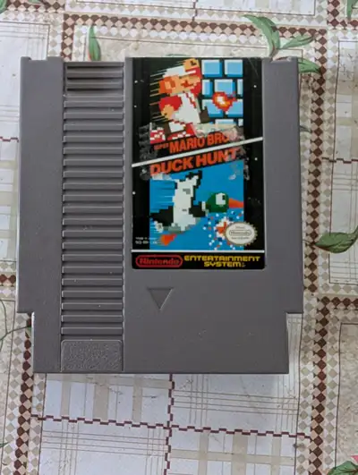 Relive the classic gaming era with this original Nintendo Entertainment System (NES) cartridge featu...
