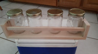 spice rack with glass jars.