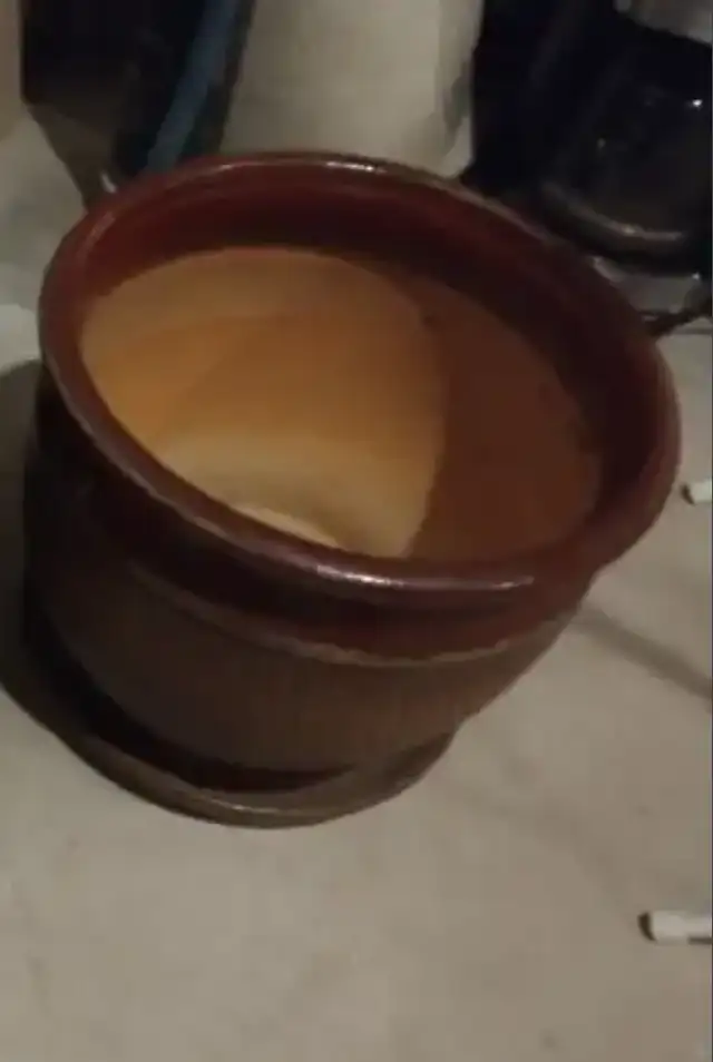 A Large ceramic pot with a drain hole and saucer.63882168734979120