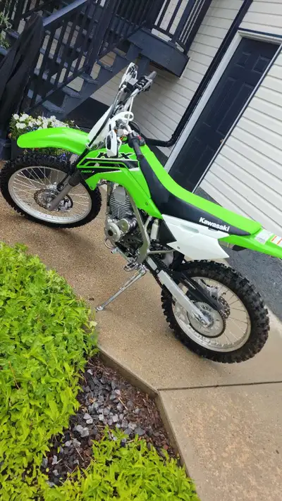 Kawasaki Barely driven. Great condition. Handlebars installed. Brand new battery installed June 2025...