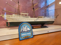 Tall ship model in display case. 