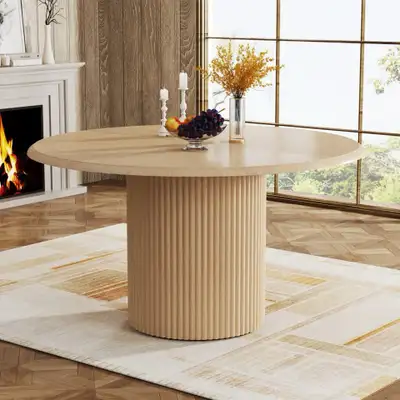 Elevate your dining space with this round dining table, boasting a 47-inch diameter and standing 30...