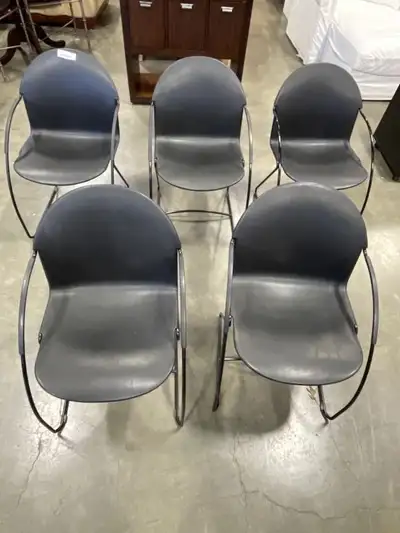 5 BLACK PLASTIC STACKING CHAIRS, View more