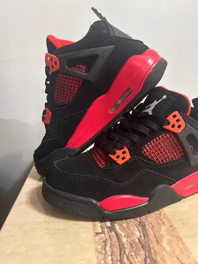 Jordan 4s red thunder size 5.5, View more