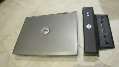 Dell D800 + docking station for parts or repair. Has 15 inch screen (no scratches). Keyboard in grea...