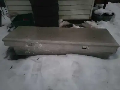 This is a sturdy, used truck tool box, perfect for keeping your tools secure and organized in your t...