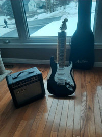 Electric guitar, Amp, and carrying case  Academy. 