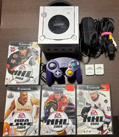 Here are the included components: - Silver Nintendo GameCube Console - Purple Controller - Power and...