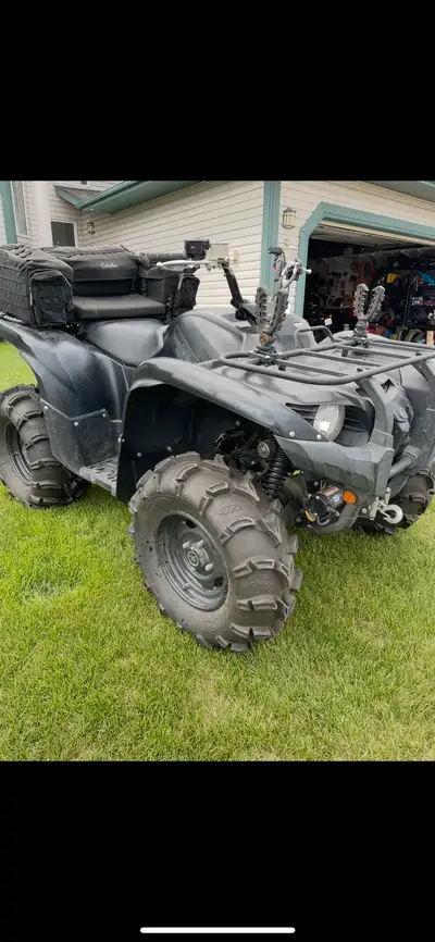 2014 special edition Grizzly 700 with power steering. Comes with rear cargo seat, flex grip tool car...