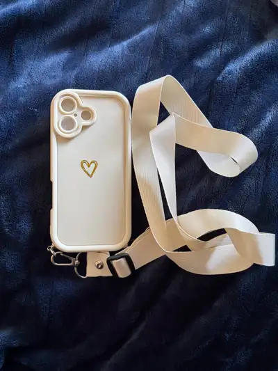 This is a super cute iPhone 11 phone case with a white strap. It's in great condition and ready to p...