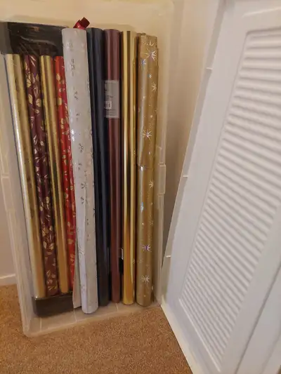 15 rolls of wrapping paper and Rubbermaid container just $25!, View more