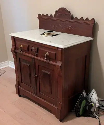 Solid wood with doors and 1 drawer. 3/4 inches real italian marble top. 30wx17dx30h. Some scratches...