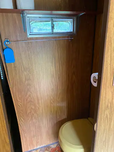 18 foot 1975 travel trailer. Requires work. Has a toilet, heater and stove.