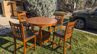 Bar height Table and 4 chairs with leaf.