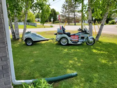 2000 Honda Goldwing 25th Anniversary Edition trike with matching tow behind trailer. Asking $13,000...
