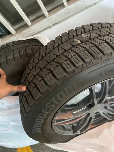 Selling a full set of 225/65/17 Bridgestone Blizzak winter tires mounted on Envy alloy rims. very mi...