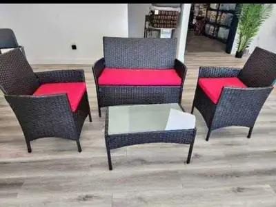 This brand new patio set includes a loveseat, two chairs, and a glass-topped coffee table, perfect f...