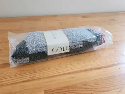 Packaged socks. 2 pack. Gray, black, and red design. Fits shoe sizes 6-12. A great way to keep your...