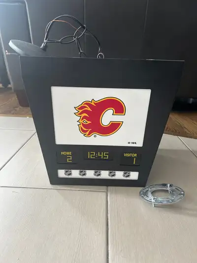 Calgary Flames jumbotron hanging light fixture for kid’s or rec room. Excellent condition. Comes wit...