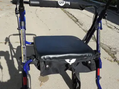 This Hugo Walker is purple and made from Aluminum...and is VERY light. It has a leather seat, brakes...
