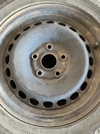Set of 4 steel rims for sale. 15”. The tires on the rims have very little tread left on them and sho...
