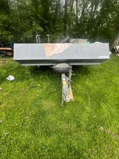 A double tip up somemobile trailer