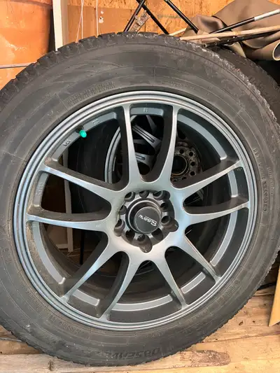 18” gunmetal rims Excellent condition Winter tires low, maybe 1 or 2 seasons left 235/55R18 Toyo obs...