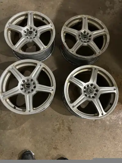 Set of four 17”x7” aluminum wheels. Dual bolt pattern of 5x100/114.3 mm. 62.4 offset. Some corrosion...