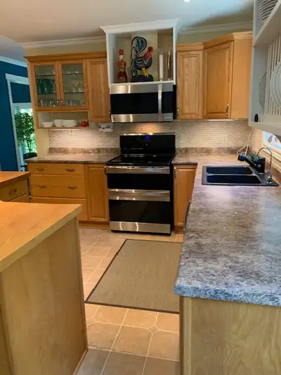 SOLD - Oak kitchen and island cabinets for sale., View more