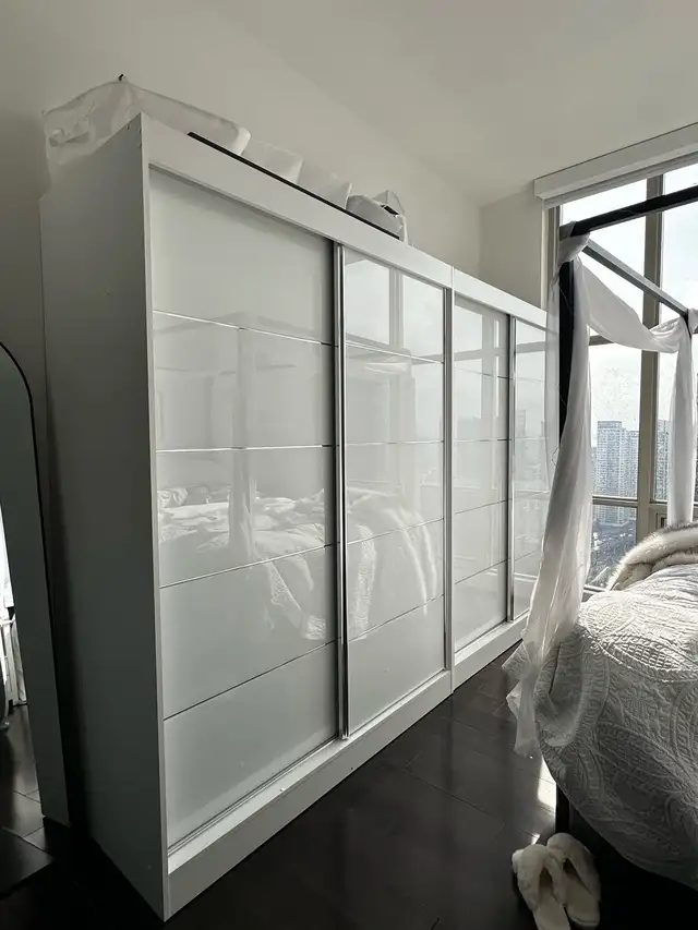 2 Huge White Sliding Glass Wardrobes / Armoires – 7 Hanging Rods