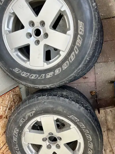 I'm selling a set of used rims and tires, size P255/73R18 112S. They are Bridgestone Dueler A/T tire...