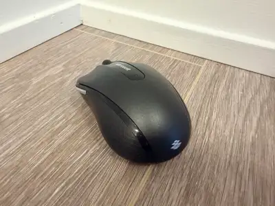 A Microsoft wireless mouse that has been tested and works without issues. Has minor scuff marks but...