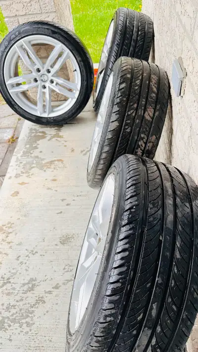 Selling a set of genuine Audi rims with summer tires, size 225/45/R18. These have been used very rar...