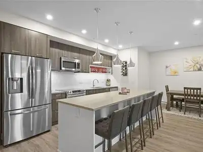 ABOUT THE CONDO UNIT - 1,216 square feet - Built in 2019 - Condo faces protected creek / forest - Fl...