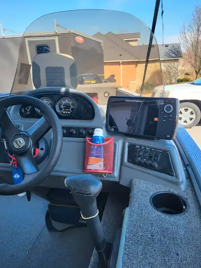 Mint condition Lund Boat for sale. Boat has live well, electric bow mounted anchor, sport track with...