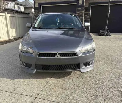 2010 Lancer, clean inside and out, sporty little car, comes with New set of all season tires on rims...