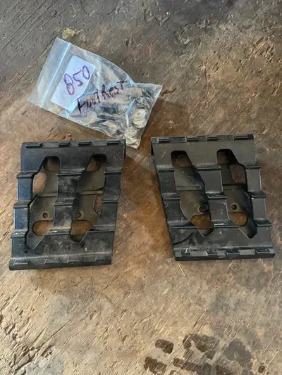 Foot rest with bolts and nuts.