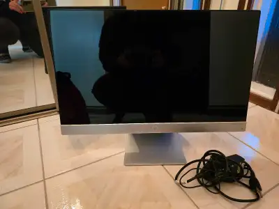 Slim silver monitor. Includes power cord. Excellent condition.