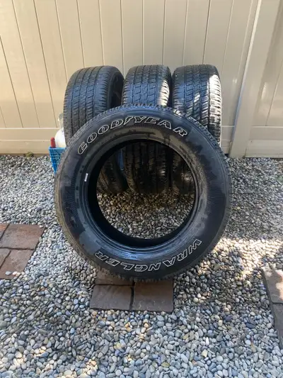4 used P275-60R29 Wrangler tires (M-S). Three tires have good tread left