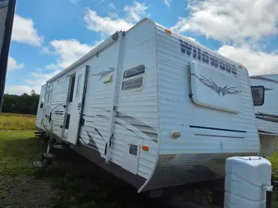 Check out this 35' Park trailer with 2 slides Rear Master Bedroom out in slide is a Queen size walk...
