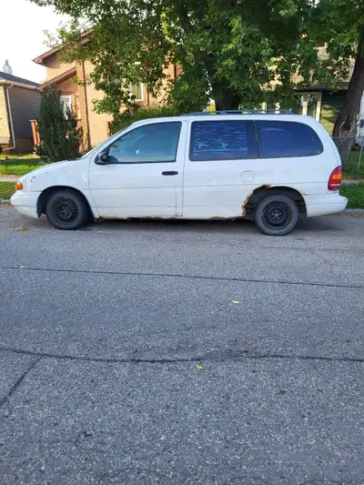 I'm selling a 1998 Ford Windstar van, a reliable vehicle with ample space, perfect for families or c...