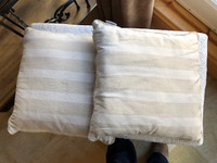 2 decorative ivory striped throw pillows
