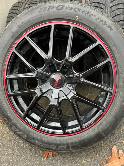 Four B F Goodrich Winter T/A 235/50R18 Tires on Touren alloy rims with TPMS Sensors. The rims have d...