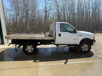 2006 Ford F350 6.0 Powerstroke Flat Deck Snow Setup 116,000 km Low km 6.0 diesel work truck with alu...