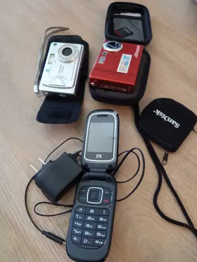 Minolta DiMAGE E50 Camera, Vivitar Camera, and ZTE Flip Phone, View more