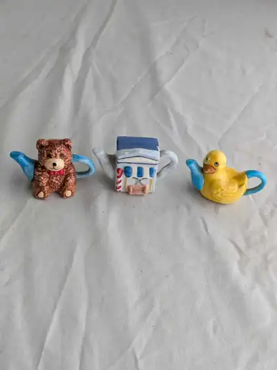 Add some charm to your collection with these delightful miniature teapots! This set includes a Red R...